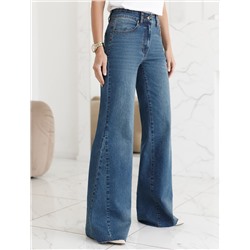 Джинсы клеш от колена из эластичного денима