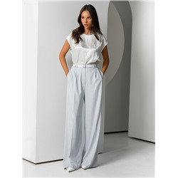 Блузка молочного цвета с бусинами по переду